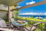 The large, private lanai features a table and seating for four